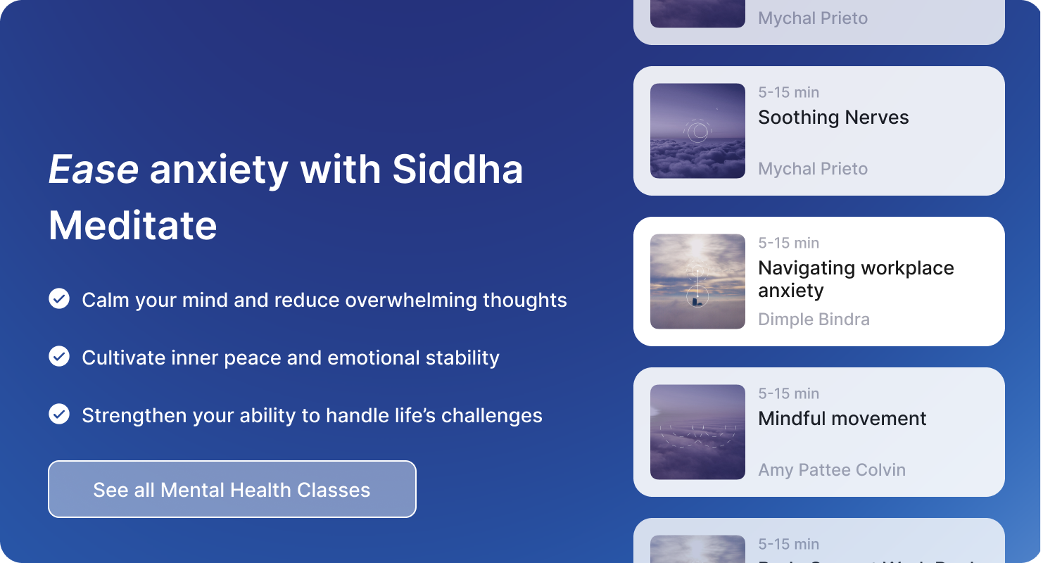 A person sitting cross-legged on a yoga mat, practicing deep breathing to calm their mind.